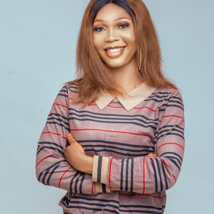 Alex Rivera, Lead Design Curator at Zephiro Lyticium, reviewing corporate floral arrangements